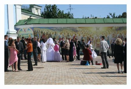 It's a wedding day tradition to take bridal pictures by all the sights in Kiev.  Here you see two brides, but there were at least five at St. Michael's.