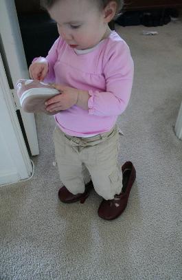 Audrey has liked putting Laura's shoes on lately.  We think it's cute.