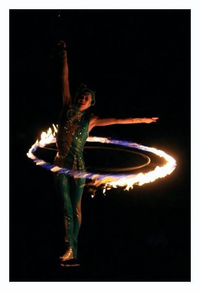 Hula hooping the ring of death while suspended in the air.
