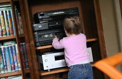 She helped Uncle Glen rearrange the stereo system so that she could push the buttons.