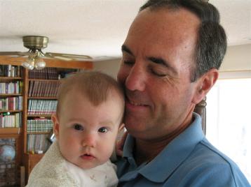 Audrey says good-bye to her Grandpa.  She had fun meeting and getting to know all of her relatives.  At least we think so.  We presume that's what she was smiling about.