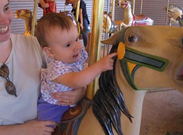 Two pics of Audrey on the carousel.  She's such a cutie!