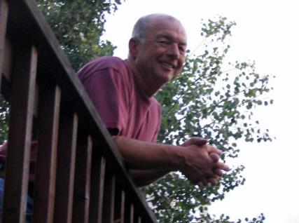 My dad leaning over our deck.  I just thought this picture turned out rather well.