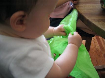 Audrey playing with some green tissue paper. Hey, anything to keep her happy.