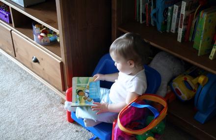 Laura caught Audrey just sitting and reading a book on a Sunday morning.  Nice quit activity.